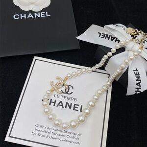 CHANEL White Pearl Necklace with Gold Details